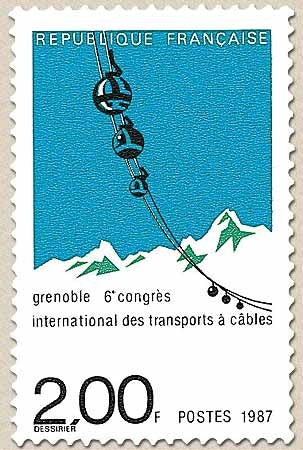6e Congrès international des transports à câbles, à Grenoble. Chaîne de nacelles sur fond montagneux  2f Y2480
